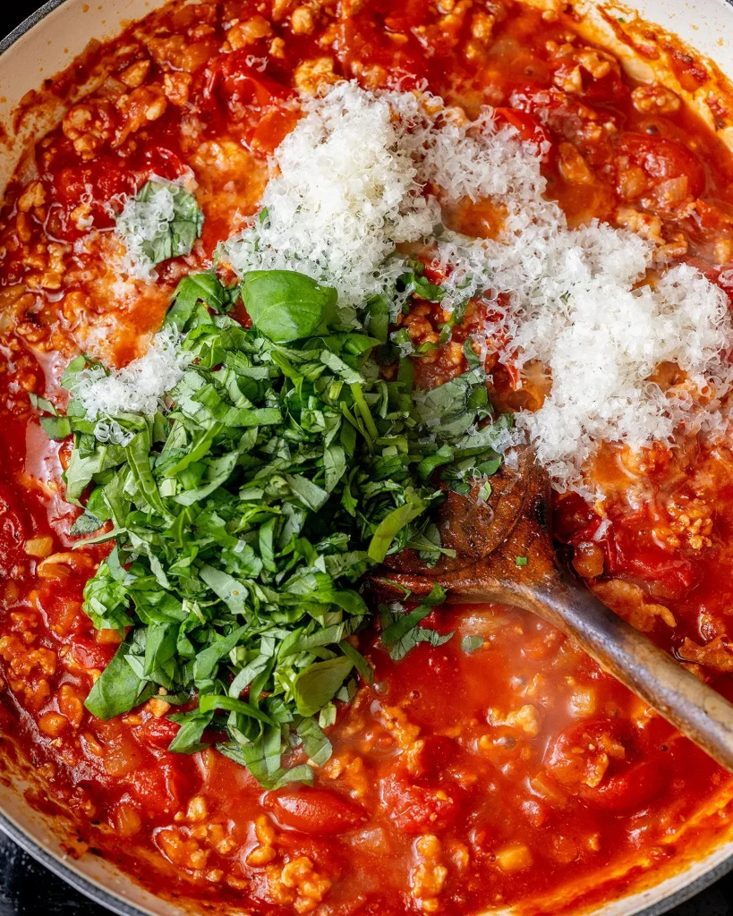 Add basil and Parmesan