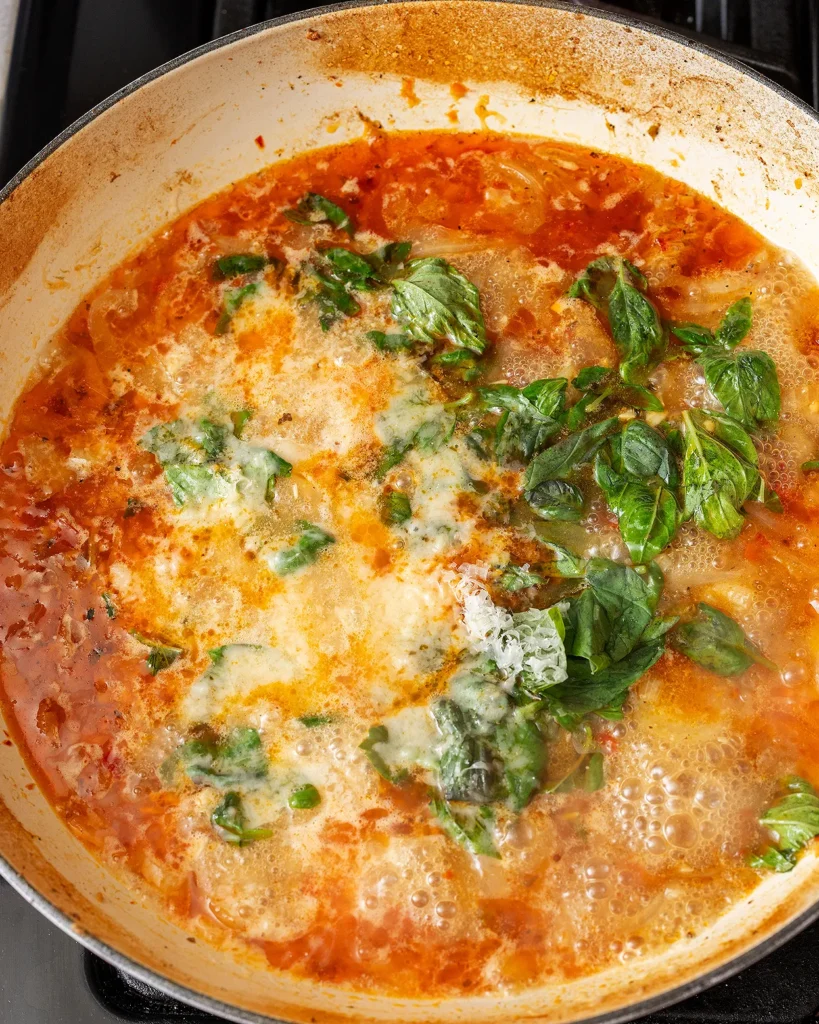 Add basil and Parmesan
