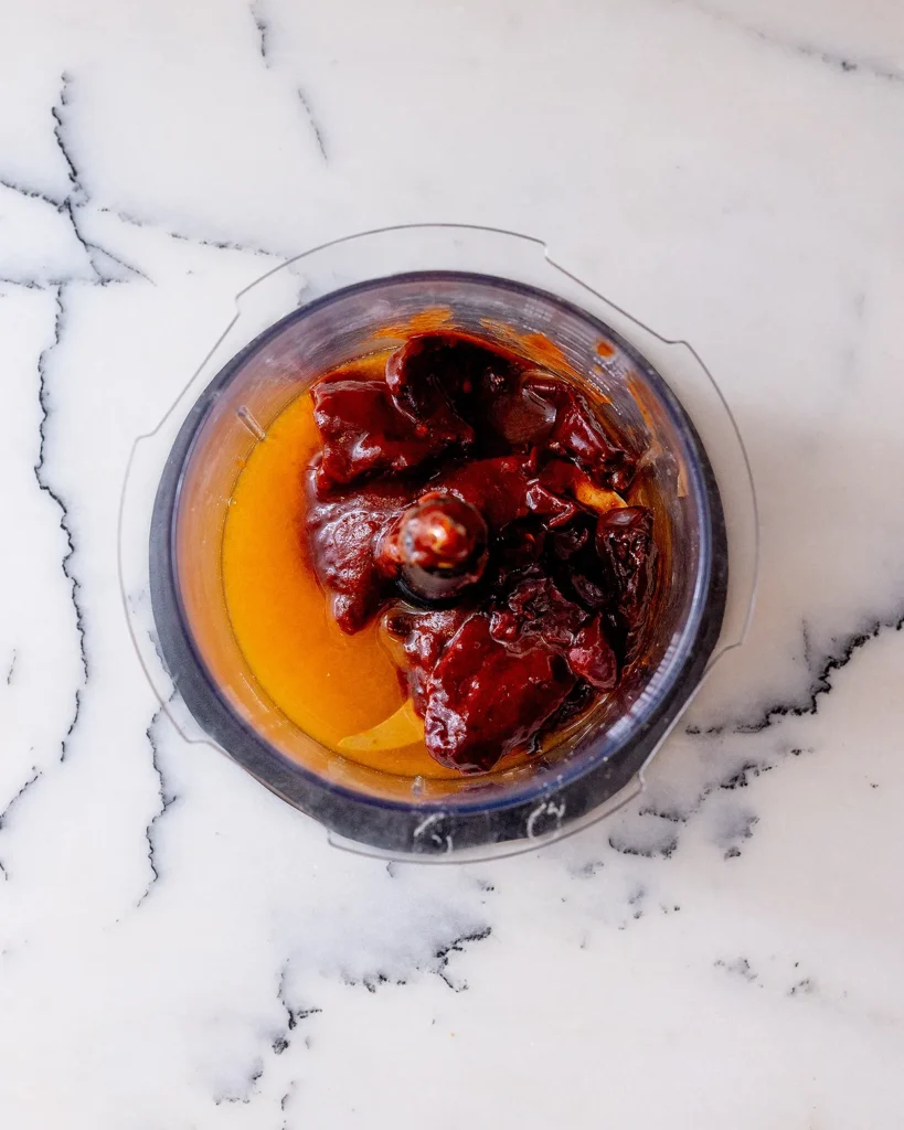 Add chipotles in adobo sauce to food processor
