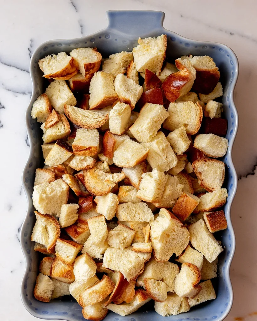 Add cubed bread to a baking dish