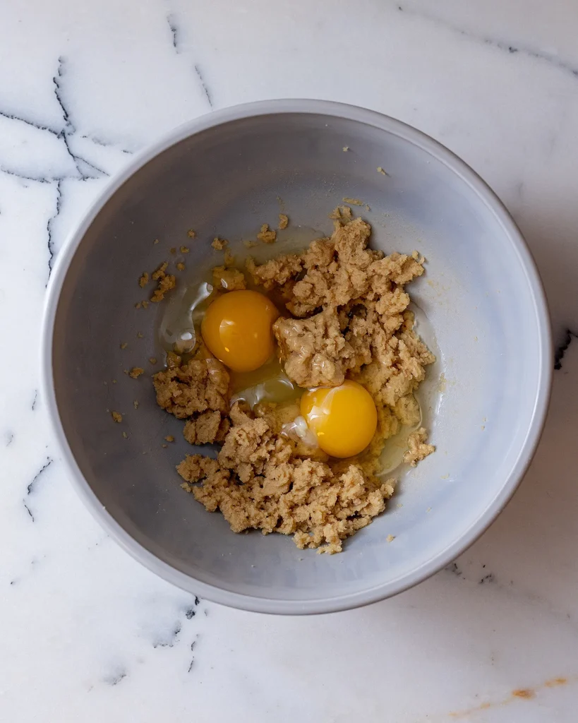 Add eggs to brown sugar and butter