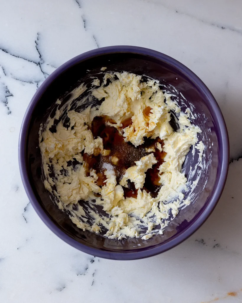 Add maple syrup to creamed butter and cream cheese