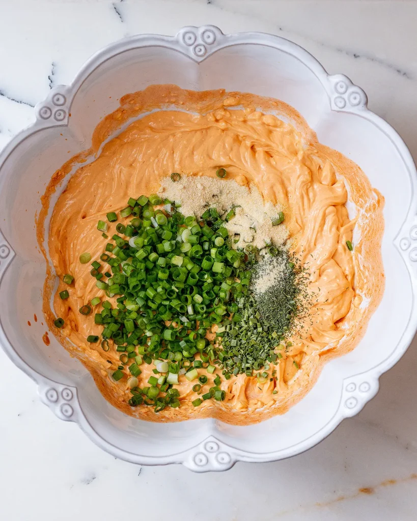 Add scallions and herbs to Buffalo turkey dip