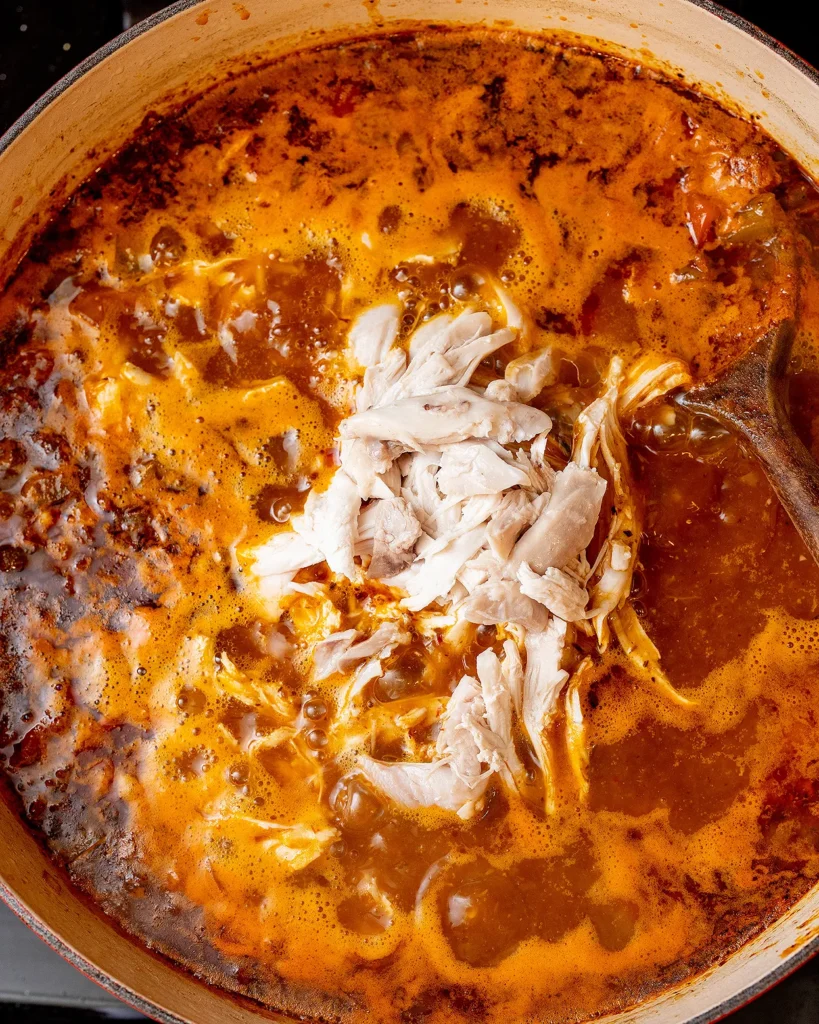 Add shredded chicken to soup