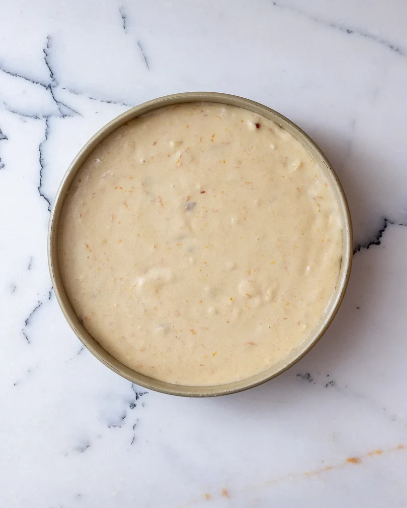 Pour orange batter into cake pan