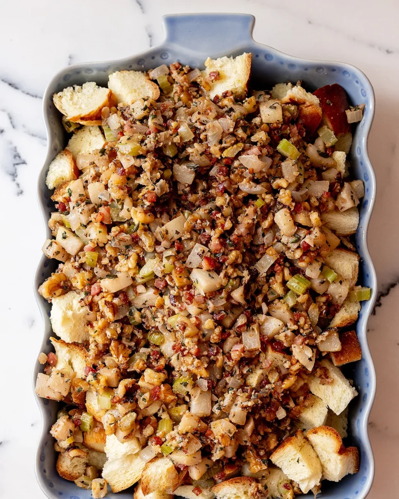 Pour pancetta and pears for stuffing