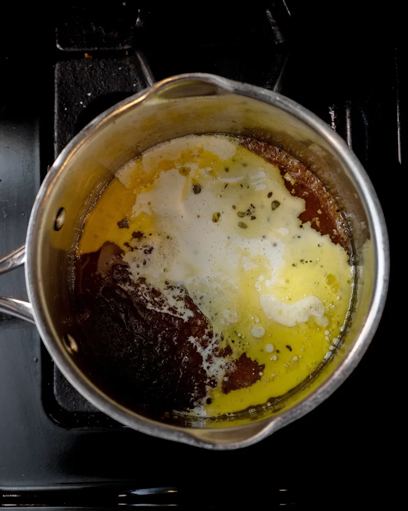 Add cream and vanilla to caramel