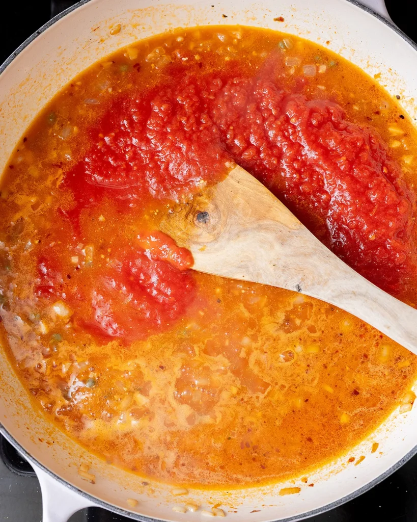 Add crushed tomatoes