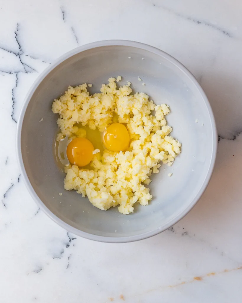 Add eggs to flour and sugar
