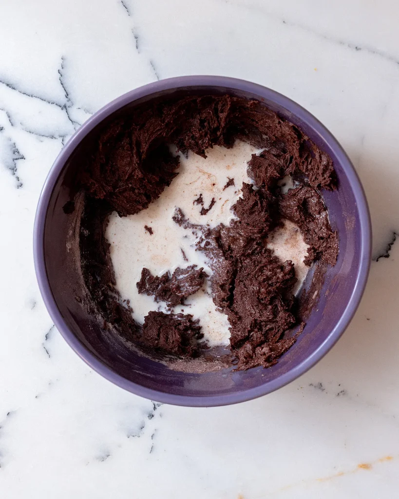 Add milk to chocolate cake batter