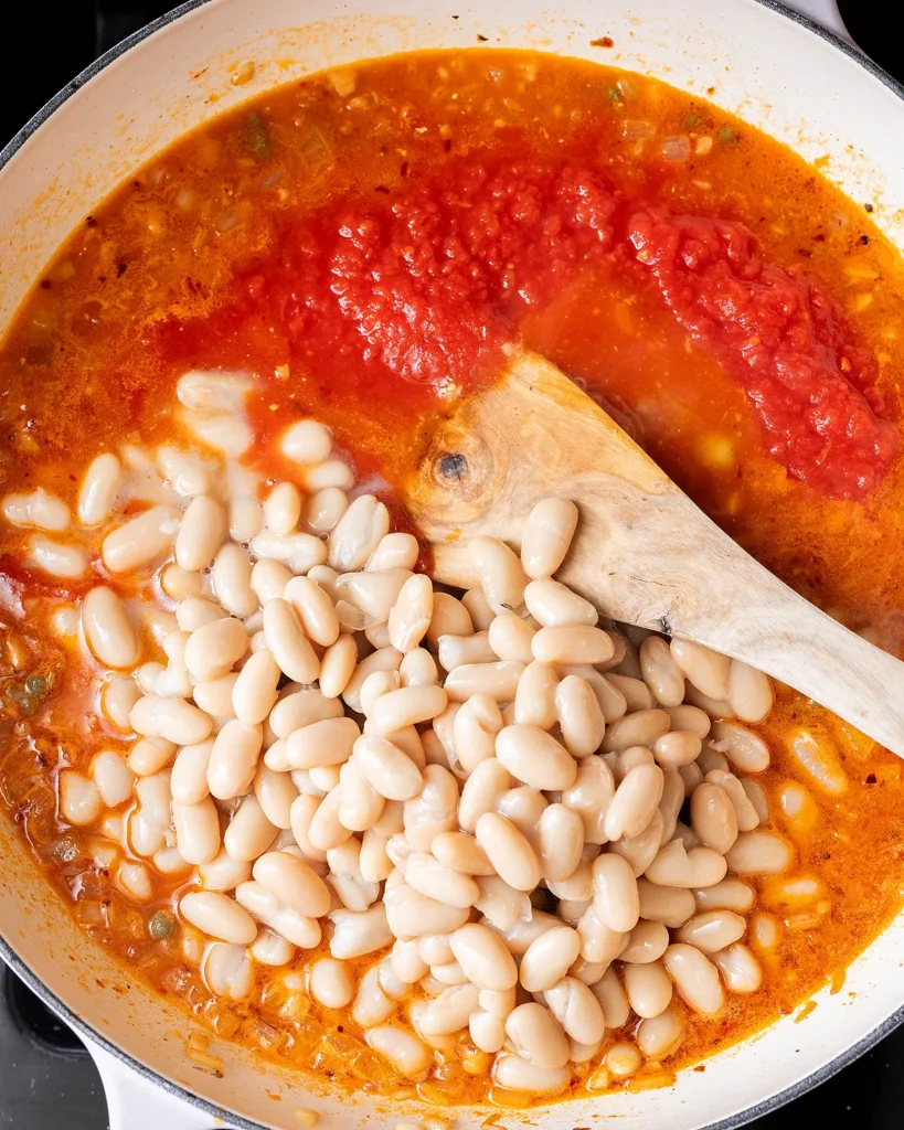 Add white beans and tomatoes