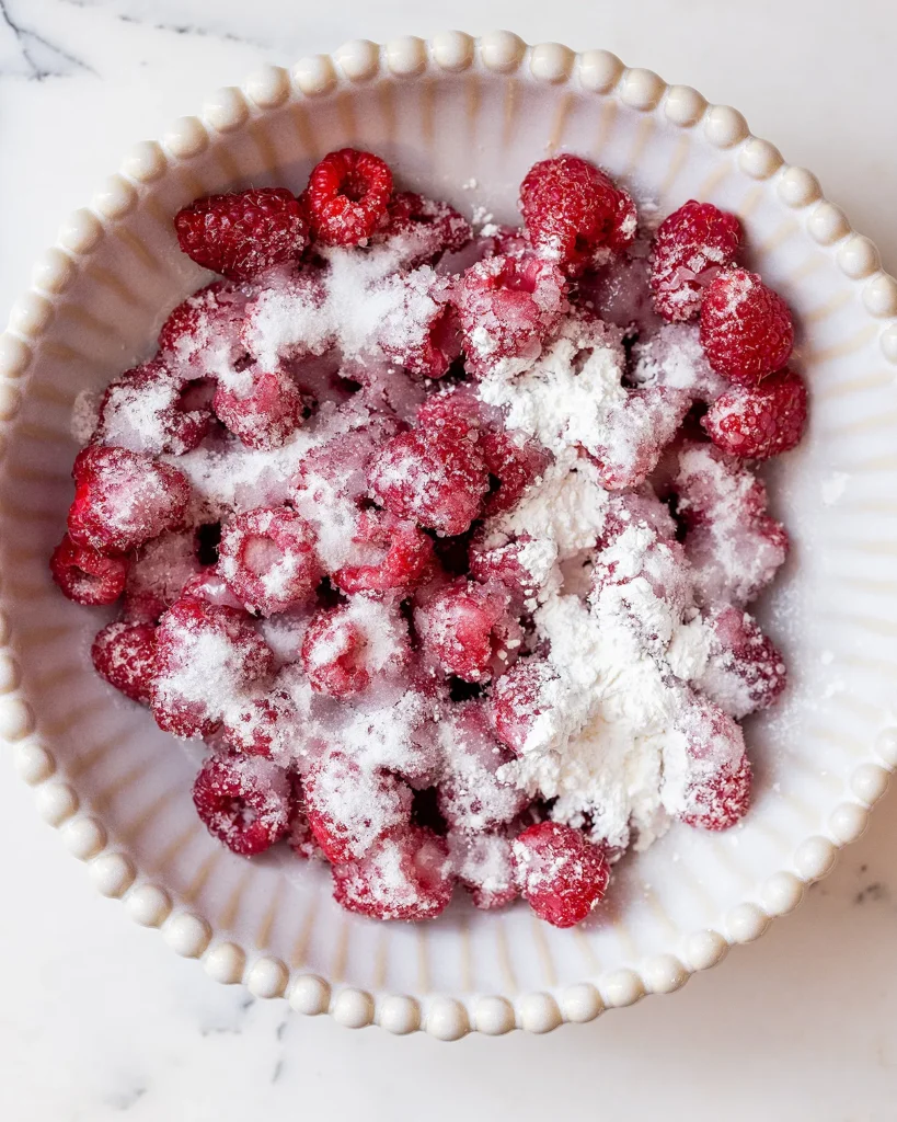 Coat raspberries in sugar and cornstarch