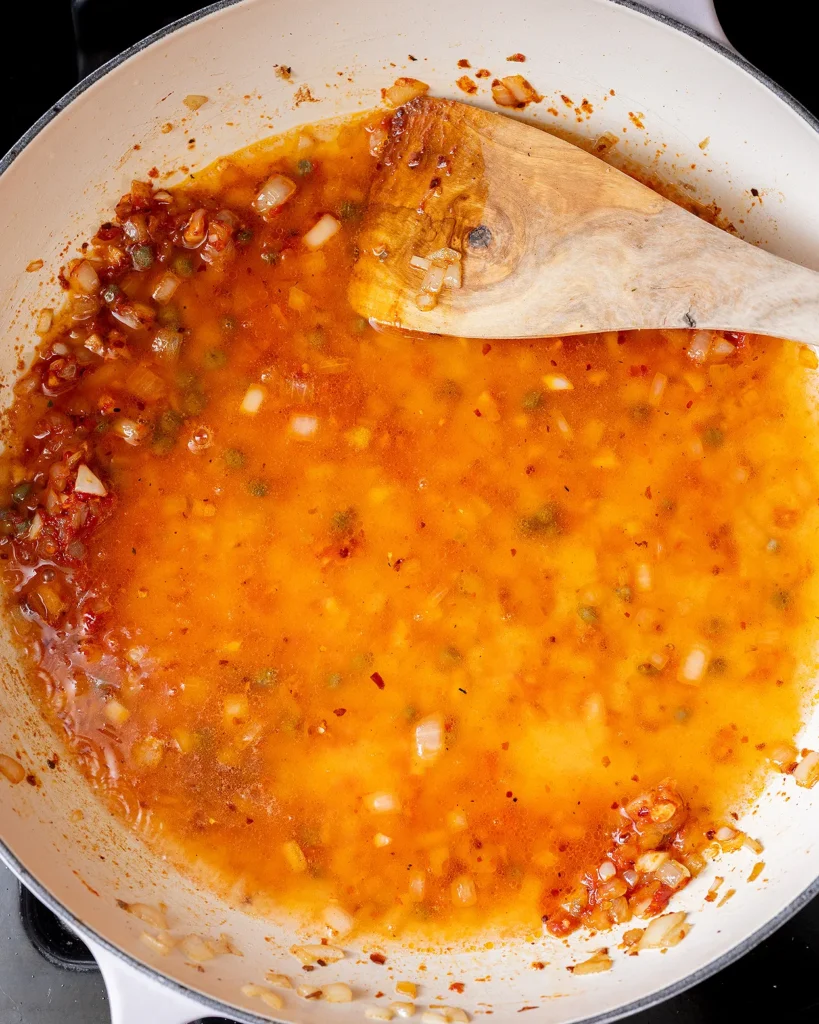 Deglaze pot with chicken stock