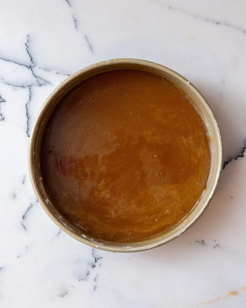 Pour caramel into pan