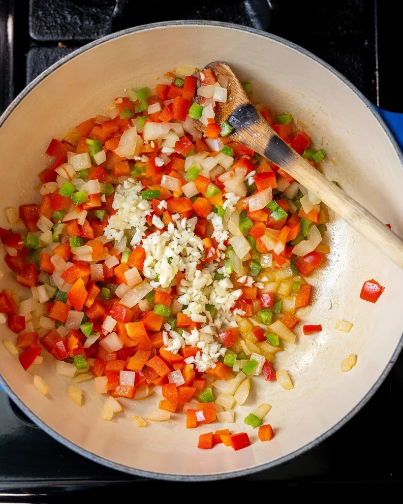Sauté peppers and onions
