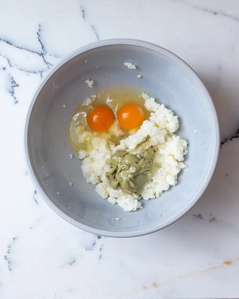 Add eggs and pistachio butter to sugar