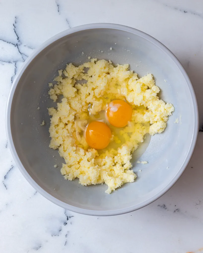Add eggs to cake batter