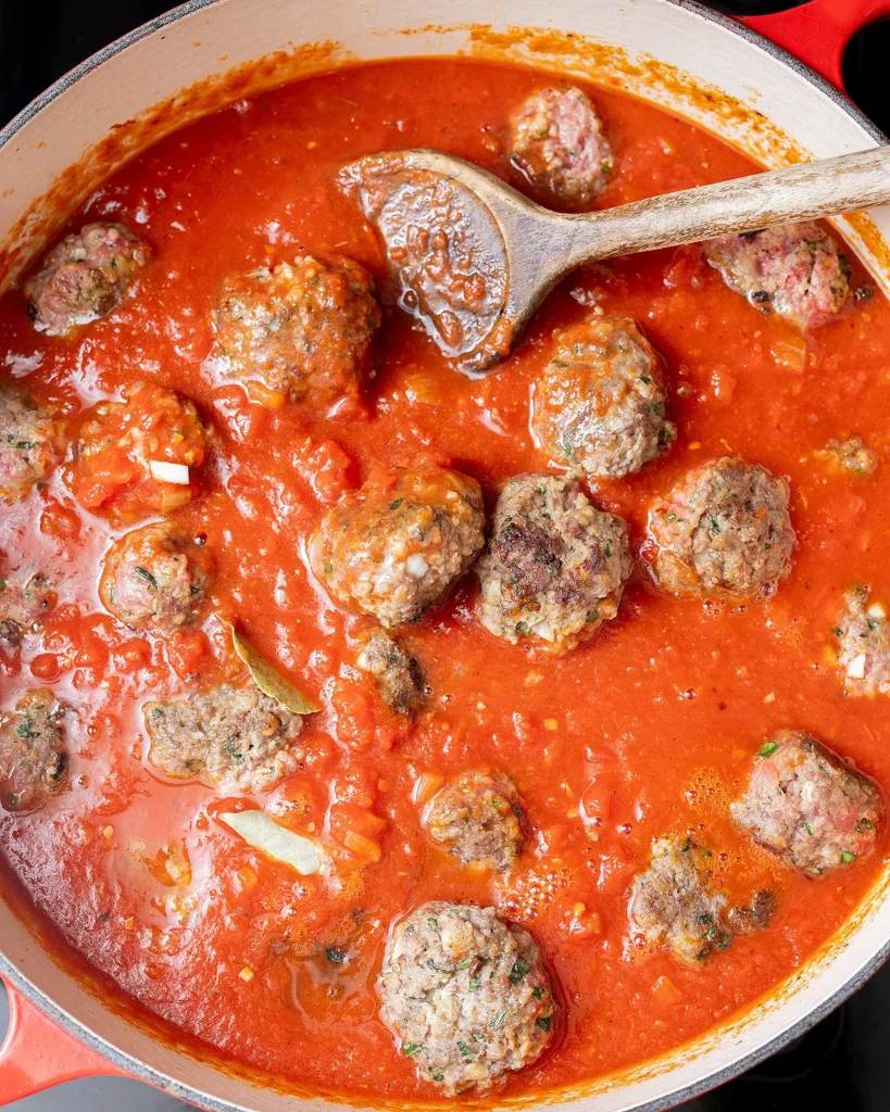 Add meatballs back to sauce
