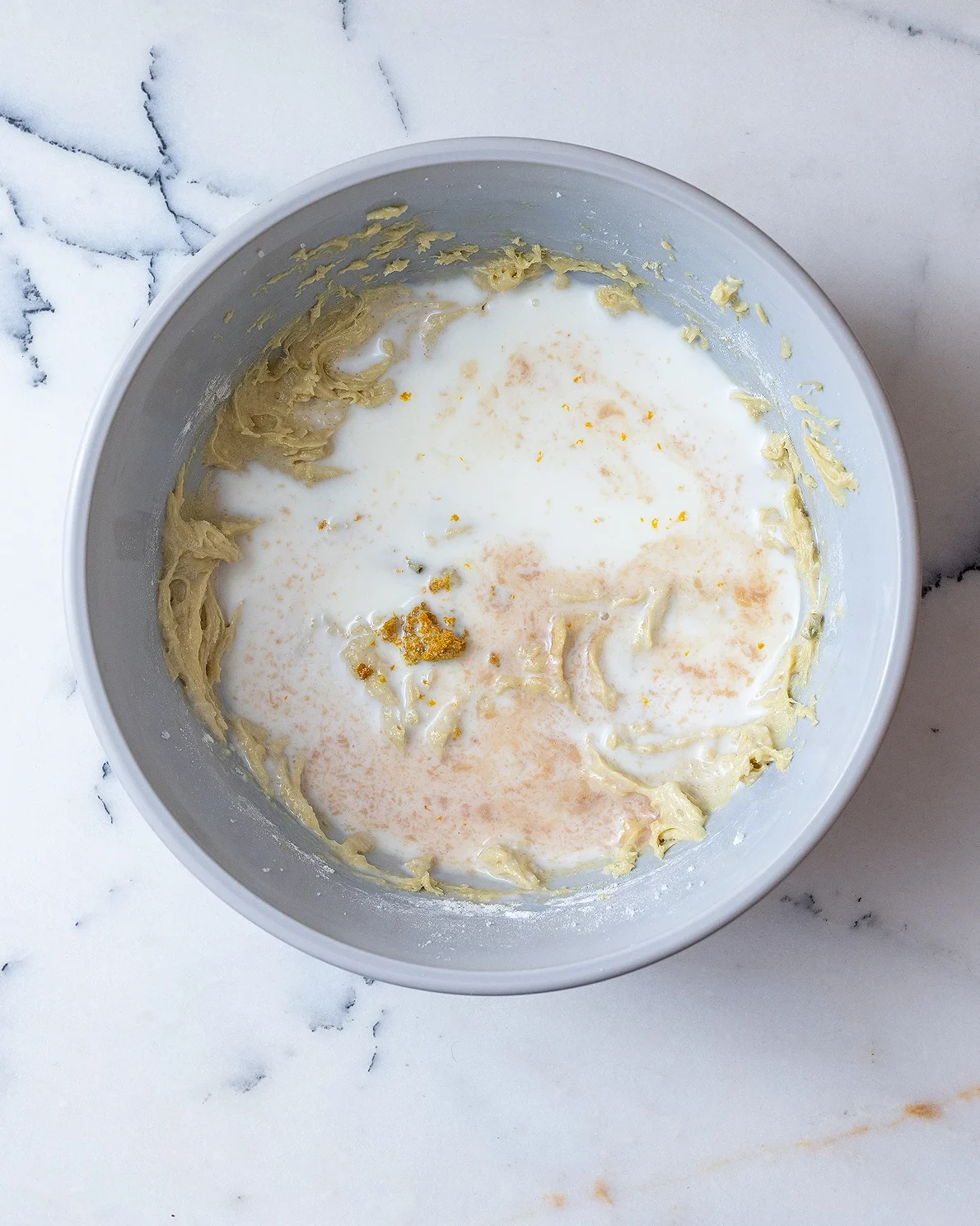 Add orange zest vanilla and milk to batter