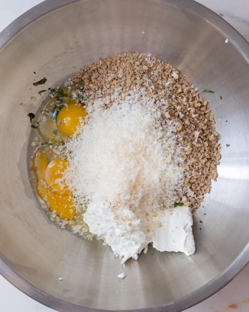 Add parmesan and ricotta