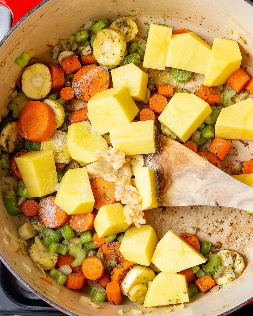 Add potatoes and mashed garlic