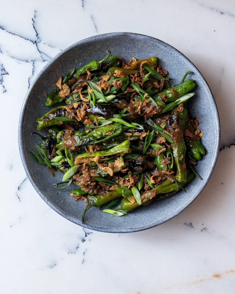 Blistered shishito peppers with vinaigrette