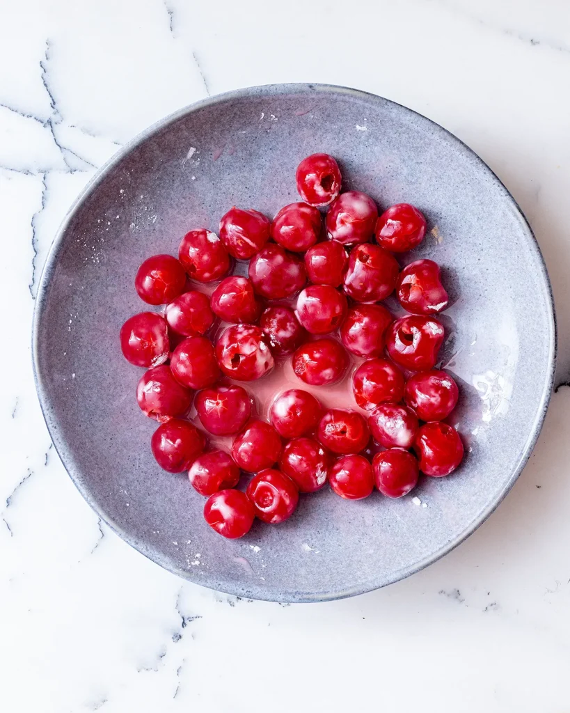 Coat cherries in cornstarch