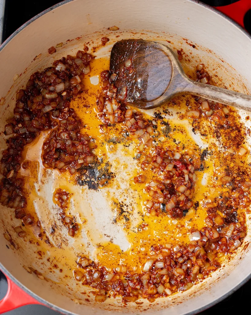 Saute the tomato paste