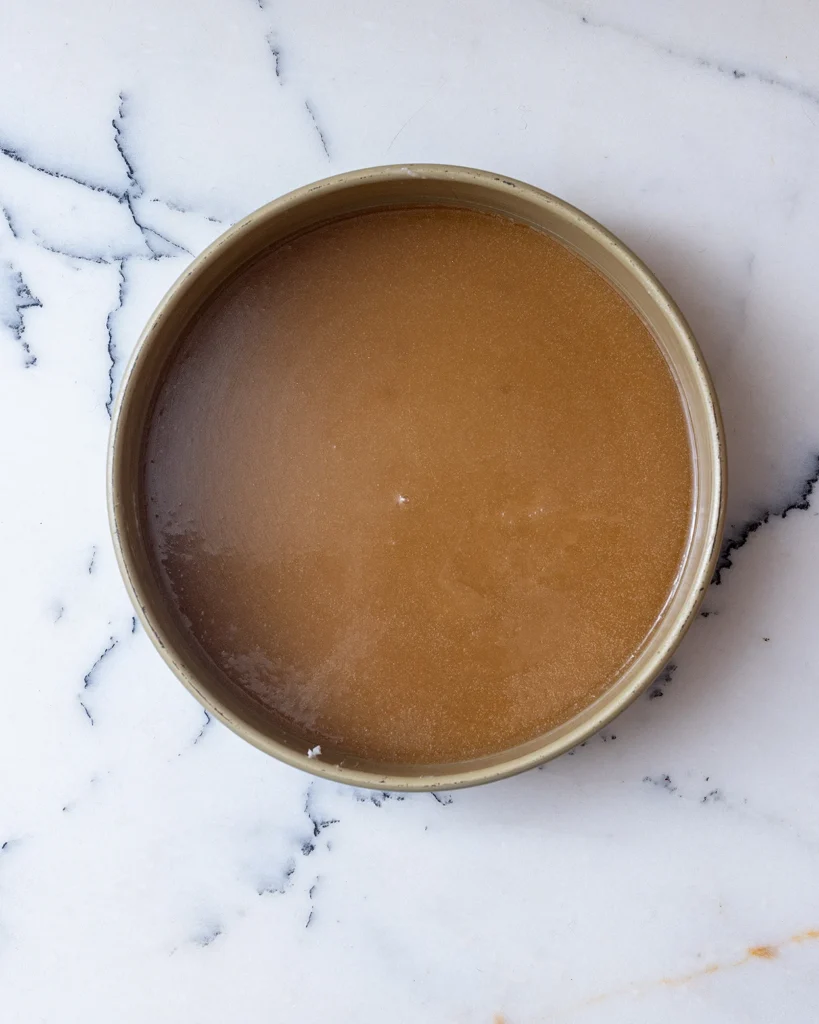 Add caramel to cake pan