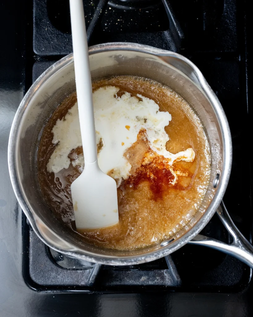 Add cream and vanilla to caramel