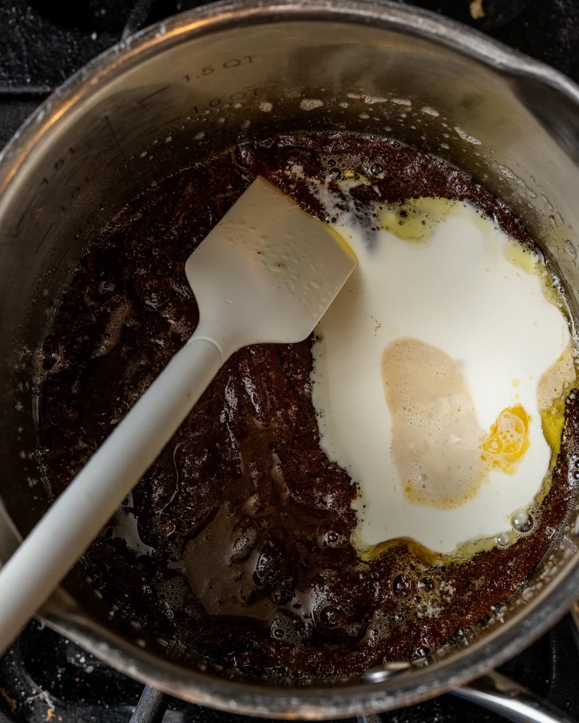 Add cream to caramel