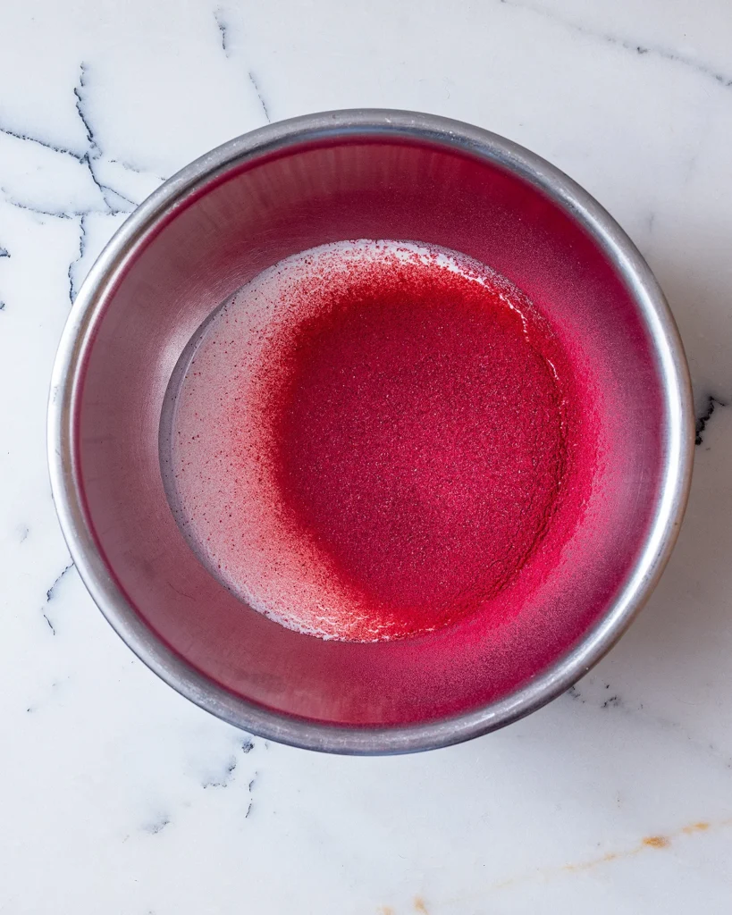 Add freeze dried raspberry powder to heavy cream