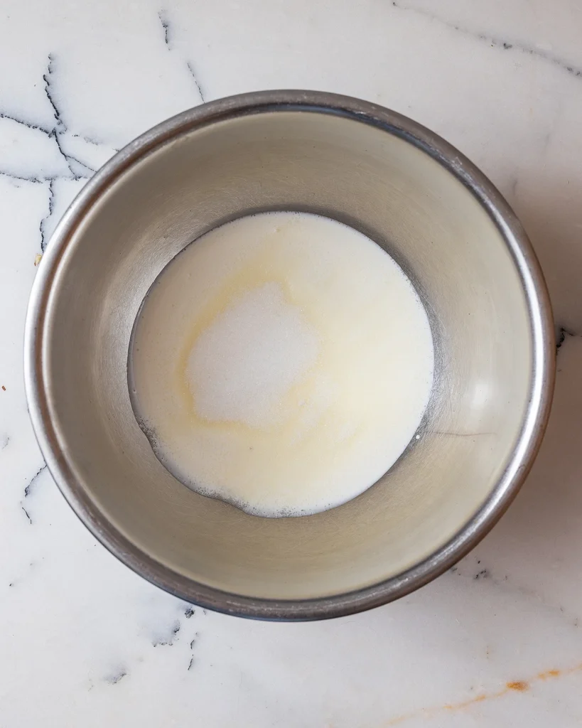 Add sugar to heavy cream