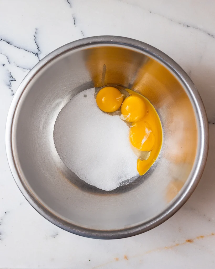 Beat egg yolks with sugar