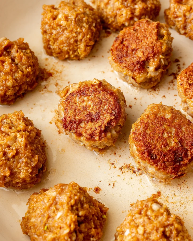 Fry meatballs until golden brown