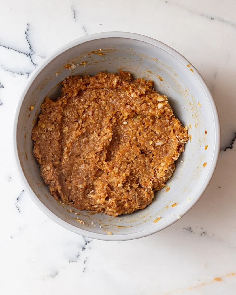 Mix the chicken with aromatics and panko