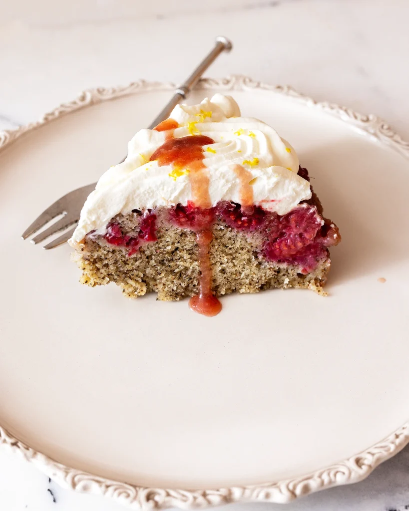 Raspberry upside down cake with frosting and syrup
