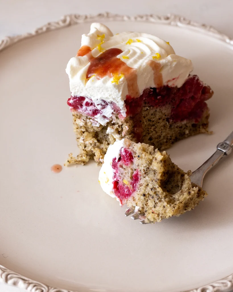 Serve raspberry London Fog upside-down cake with syrup from cake