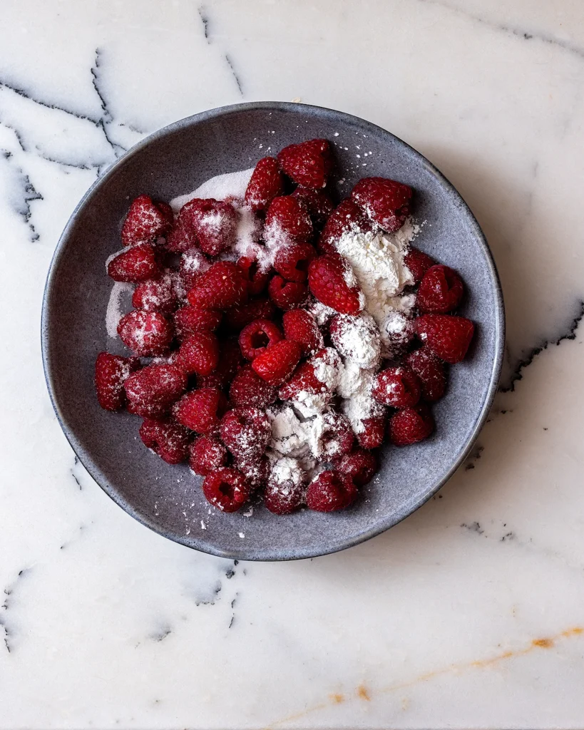 Toss raspberries in sugar and cornstarch