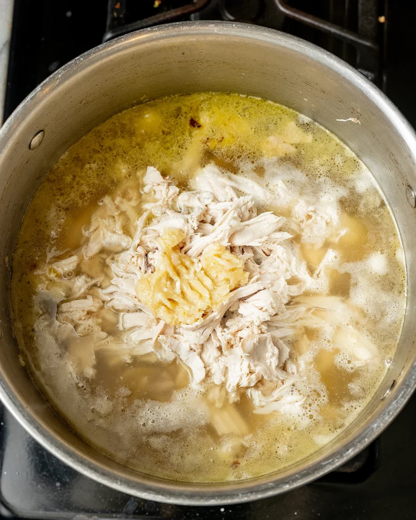 Add chicken and garlic to soup