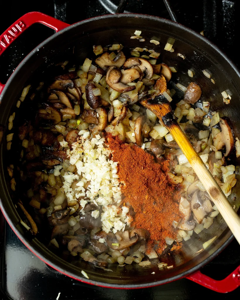 Add harissa and garlic