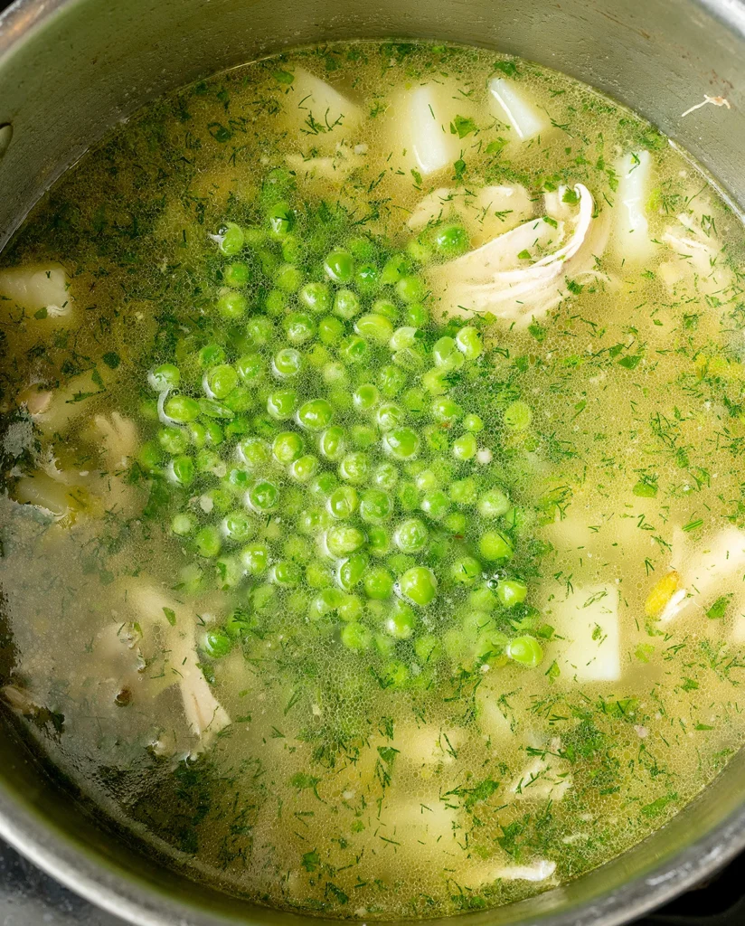 Add peas and herbs to chicken soup