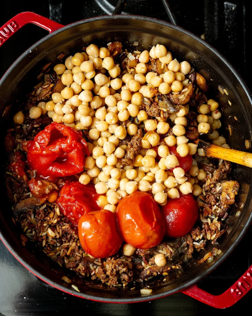 Add tomatoes and chickpeas