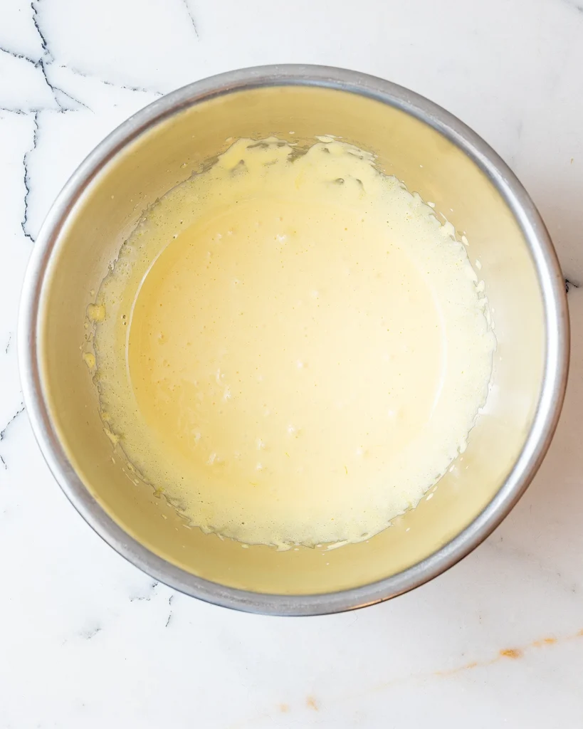 Mix eggs until thick