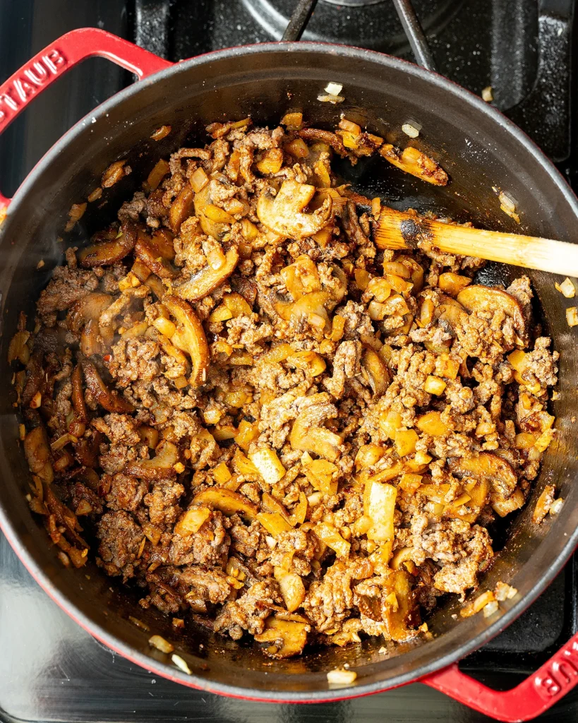 Return ground beef to pot