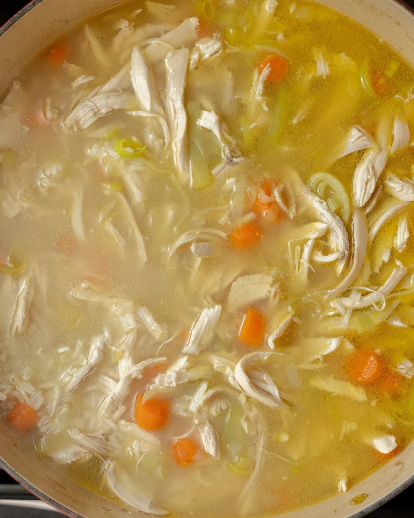 Add chicken and broth