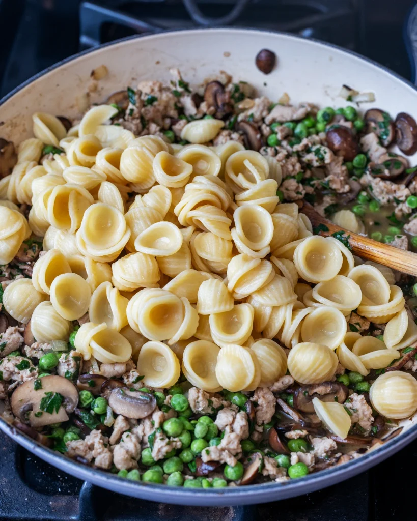 Add cooked orecchiette
