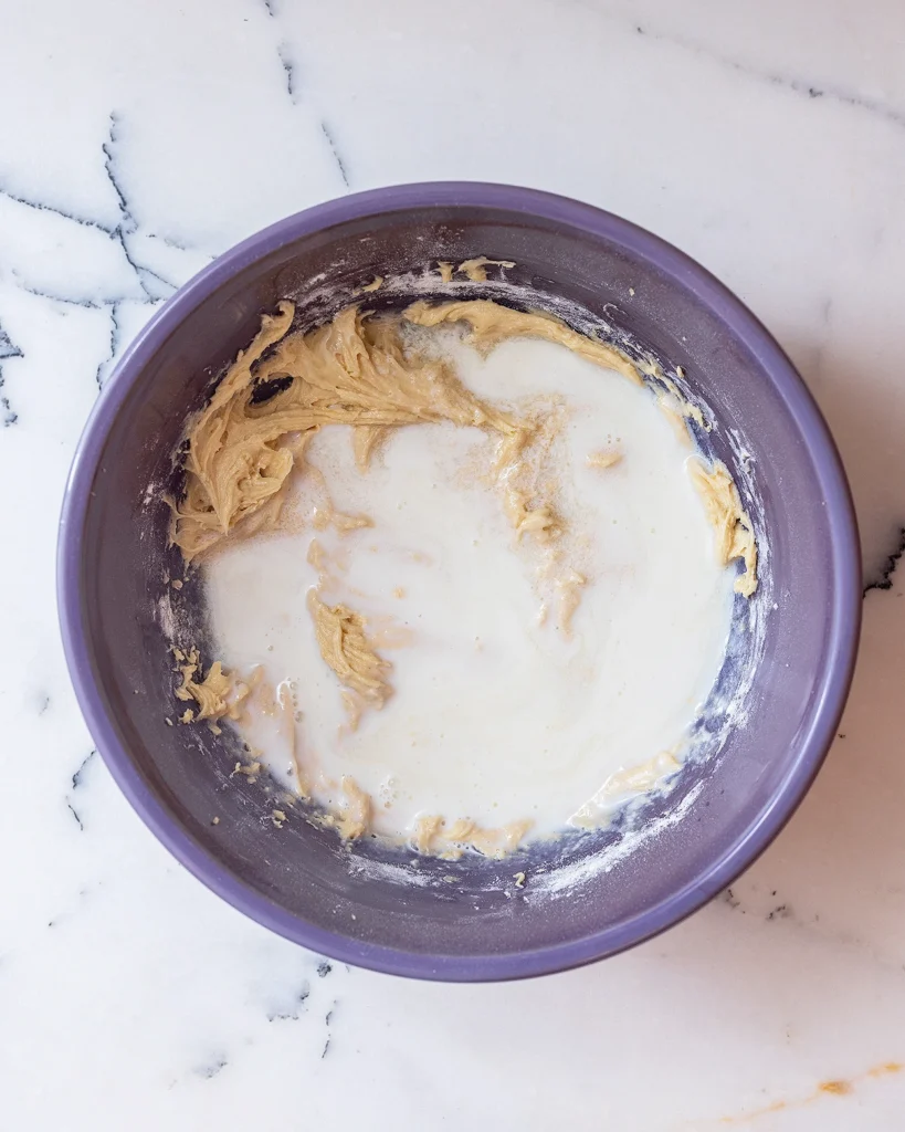 Add milk and pineapple juice to cake batter