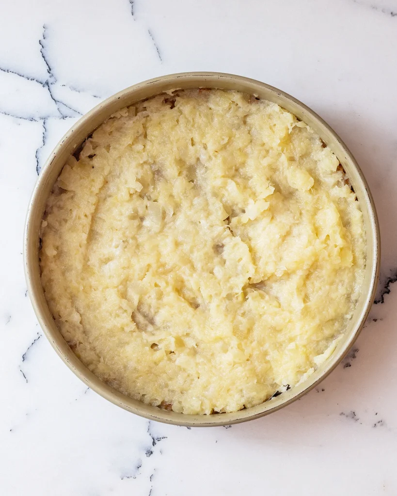 Add pineapple to cake pan