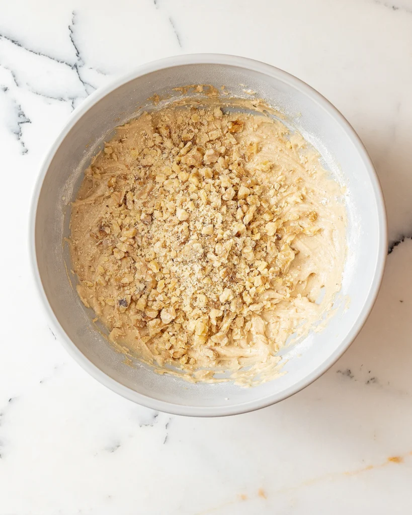 Add walnuts to cake batter